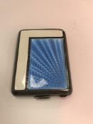 An Art Deco silver Vesta case with enamelled guilloche decoration to front in blue and cream (by