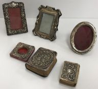 Four miniature silver mounted photograph frames,