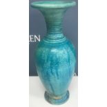 A collection of four Andrew Broughton Tompkins raku ware baluster vases in turquoise,