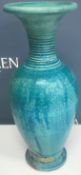 A collection of four Andrew Broughton Tompkins raku ware baluster vases in turquoise,