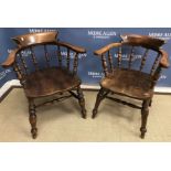 Two early 20th Century beech and elm stick back smoker's bow chairs of typical form,