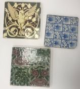 A William De Morgan tile decorated with floral design in green and mauve, stamped "W.De Morgan & Co.