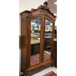 A 19th Century French walnut armoire in the Louis XV taste,
