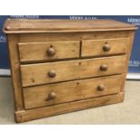 A Victorian pine chest of two short over two long drawers on a plinth base,