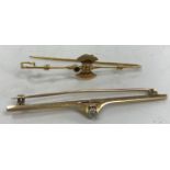 A 9 carat gold bar brooch set with solitaire diamond approx. .15 carat, 3.