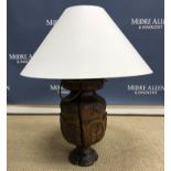 A 19th Century Sicilian carved walnut table lamp in the 17th Century style decorated with panels of