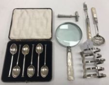A collection of small silver wares to include a set of six George V silver coffee spoons (by