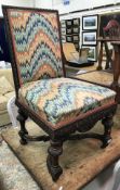A circa 1900 carved walnut framed hall chair in the Gothic Revival style,