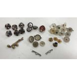 A collection of various 9 carat gold and other shirt buttons,