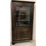 A 19th Century oak free-standing corner cupboard,
