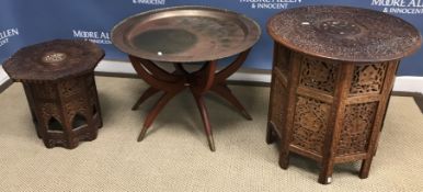 An Indian carved teak occasional table with all over floral and foliate decoration,