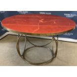 A mid to late 20th Century brass framed dining table,