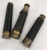 A brass three draw leather covered telescope inscribed "Cub 18X Newbold & Bulford Ltd London made