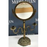 A circa 1900 brass shaving mirror,
