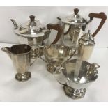 An Edward VIII silver six piece tea set of faceted slab sided form with Celtic style studded and