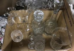 A collection of glassware to include decanters, a Laura Ashley home hurricane style lamp,