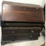 An early 19th Century oak bureau,