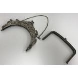 An early 20th Century pierced and cast silver evening purse mount with scrolling foliate,
