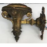 A gilt metal wall lamp with acanthus leaf decoration later converted to electric 28 cm deep x 21.