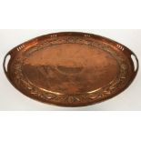 An early 20th Century Newlyn School tray of oval form with pierced galleried edge and two handles