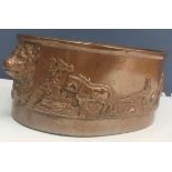 A stoneware oval game pie dish with agricultural ploughing scene in relief,