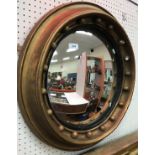 A 19th Century circular gilt framed wall mirror with ball decoration and convex glass,