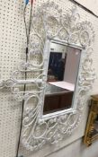 A pair of retro rectangular wall mirrors with white painted cane scrolling frames, 110 cm x 91.