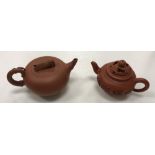 A 20th Century Chinese Yi Xing pottery teapot, the lid set with cicada handle,