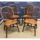 A set of four modern ash framed stick back kitchen chairs,