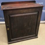 A Georgian mahogany side cabinet, the single fielded panelled door enclosing adjustable shelving,
