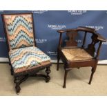 A 19th Century oak yoke back corner chair with fretwork carved back splats and rush seat on turned