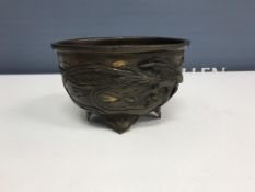 A Japanese bronzed bowl of oval form, set with running creature and phoenix type bird,