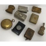 A collection of nine various Vesta cases including brass thistle, two plated brass book/stamp cases,