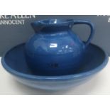 A Brannam Pottery wash jug and bowl in blue glaze, stamped "Brannam" to the base,