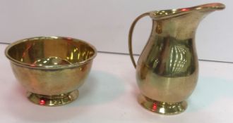 A silver gilt milk jug 9 cm high and matching sugar bowl 7.4 cm diameter (by Charles S Green & Co.
