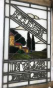A mid 20th Century stained glass window panel inscribed "Studies in glass phone 3540" depicting a