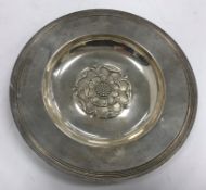 An Elizabeth II silver alms dish with central Tudor Rose embossed decoration (by C J Vander Ltd,
