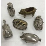 Two plated owl Vesta cases, a small pig Vesta case with flip top head, a brass pig pen wipe,