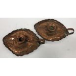A pair of circa 1900 Arts & Crafts copper chambersticks of lozenge shape with embossed fish