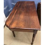 An early 19th Century mahogany single drop-leaf extending dining table,