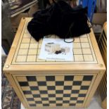 An Alison Henry game cube, each side printed with various games boards including backgammon, chess,