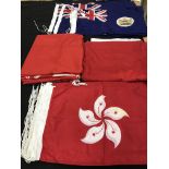 A box containing a number of flags to include 17 Hong Kong pre-independence, 70 cm x 40 cm,