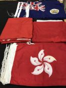 A box containing a number of flags to include 17 Hong Kong pre-independence, 70 cm x 40 cm,