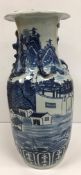 A 19th Century Chinese blue and white vase with relief dragon decoration to the narrow neck,
