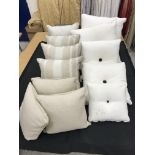 Three boxes of mainly neutral coloured cushions, together with a faux fur throw,