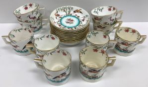 A Mintons transfer decorated and over coloured part coffee set with crane decoration (pattern