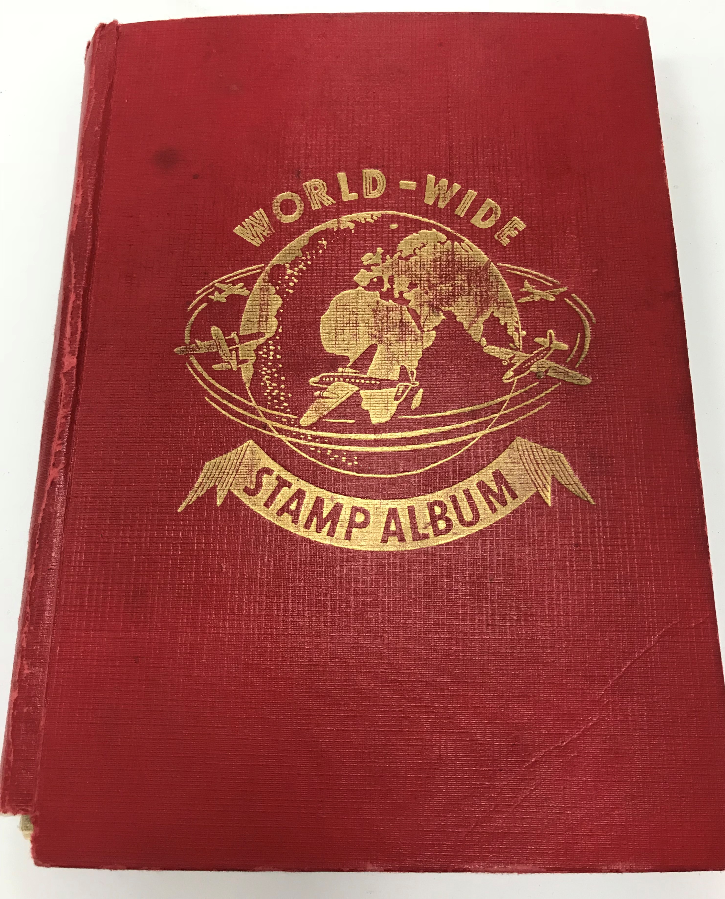 A collection of stamp albums containing various stamps of the world