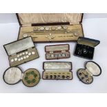 A collection of eight cases of paste buttons, studs and cufflinks, with various mother of pearl,