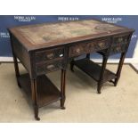 An Edwardian mahogany kneehole desk in the Chippendale Revival manner,