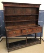 A 19th Century mahogany dresser in the 18th Century manner,